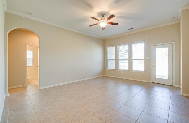 spare room with plenty of natural light, crown molding, and ceiling fan