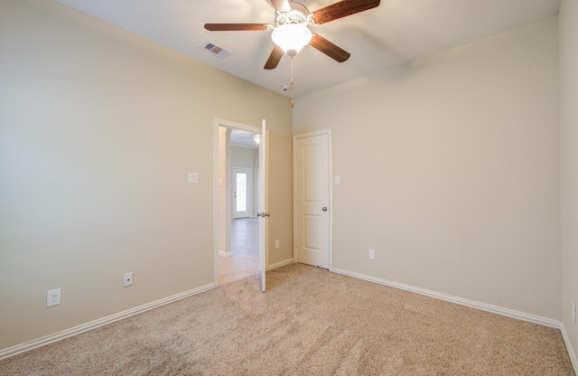 spare room with light carpet and ceiling fan