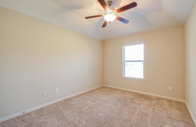 unfurnished room with ceiling fan, light colored carpet, and lofted ceiling