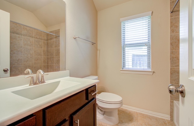 full bathroom with tiled shower / bath combo, tile patterned floors, vaulted ceiling, toilet, and vanity