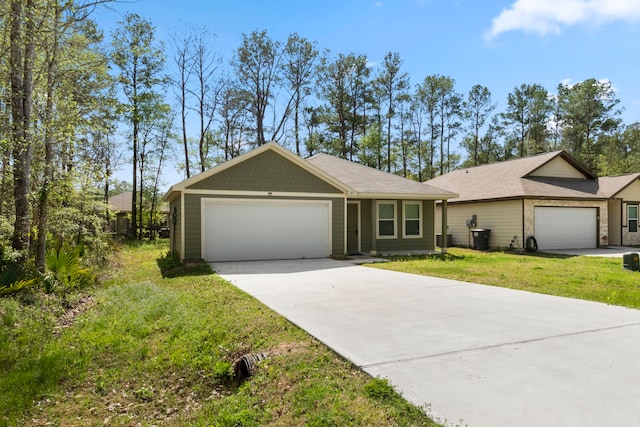 ranch-style home featuring a garage and a front lawn