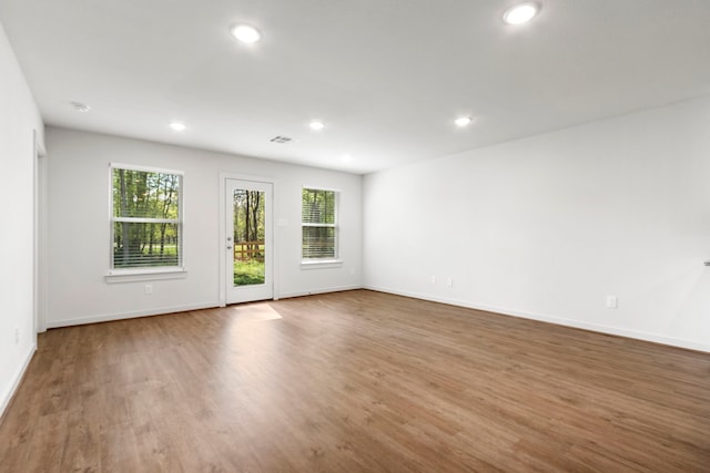 spare room featuring hardwood / wood-style floors