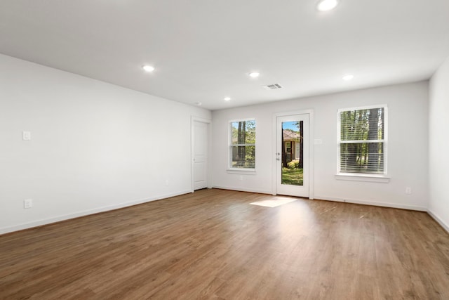 empty room featuring hardwood / wood-style flooring