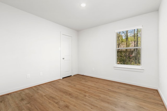 unfurnished room featuring light hardwood / wood-style floors