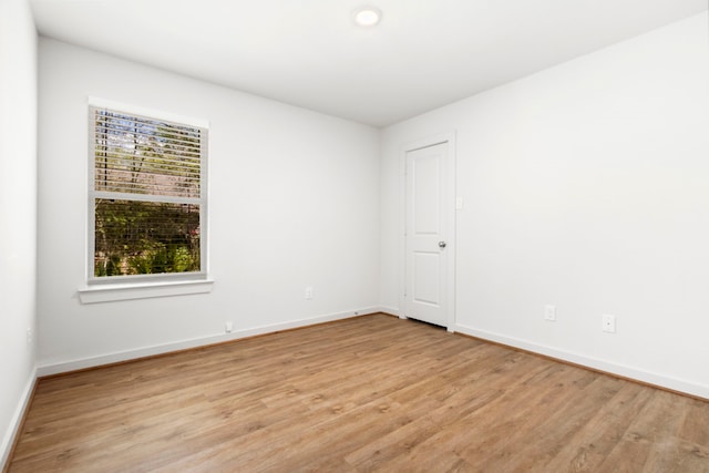 empty room with light hardwood / wood-style floors