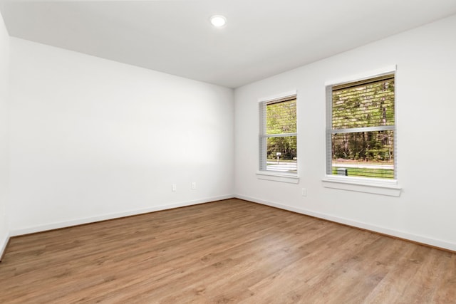 unfurnished room featuring light wood-type flooring