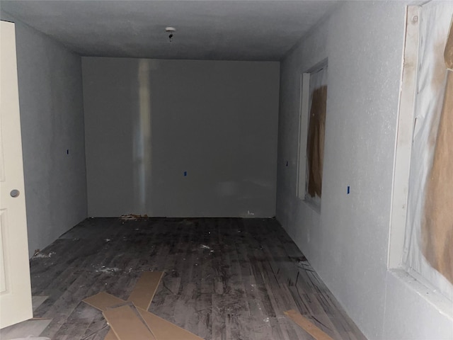 spare room with dark hardwood / wood-style flooring