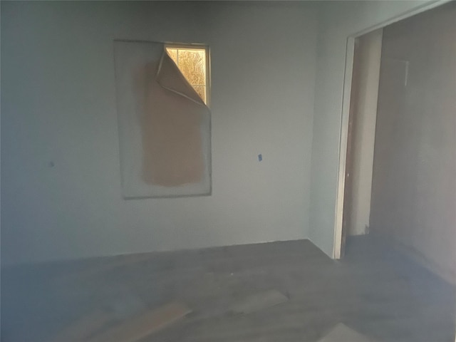 unfurnished room featuring concrete flooring