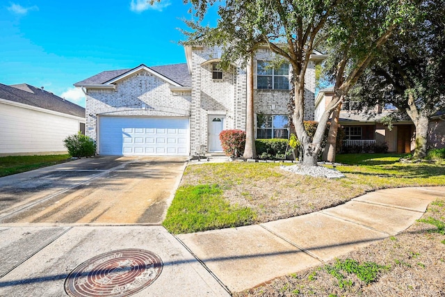 view of front of house with a garage and a front yard