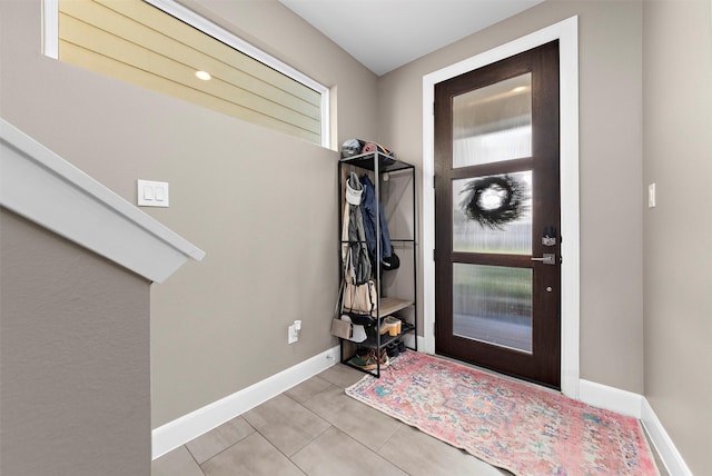 entrance foyer featuring light tile patterned flooring