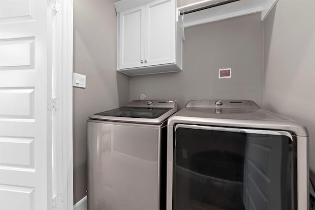 laundry area featuring cabinets and washer and dryer