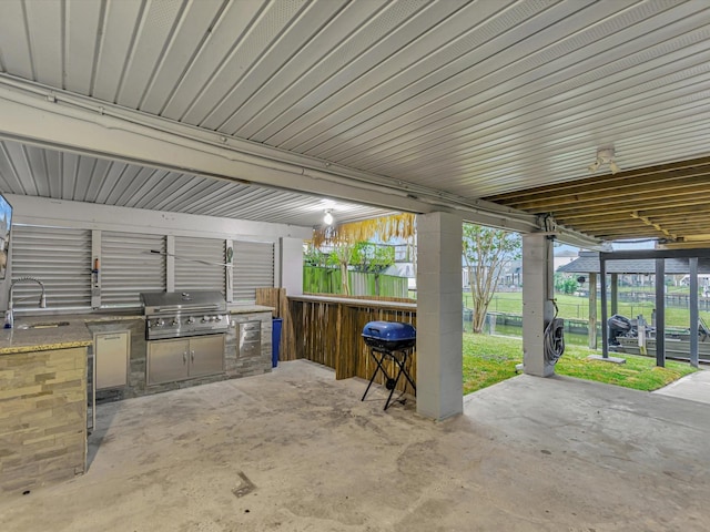 24 N Omega St, La Marque, TX 77568 - view of patio featuring area for grilling, sink, and grilling area