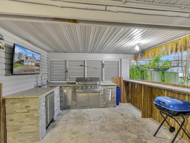 24 N Omega St, La Marque, TX 77568 - view of patio / terrace featuring a grill, sink, and exterior kitchen