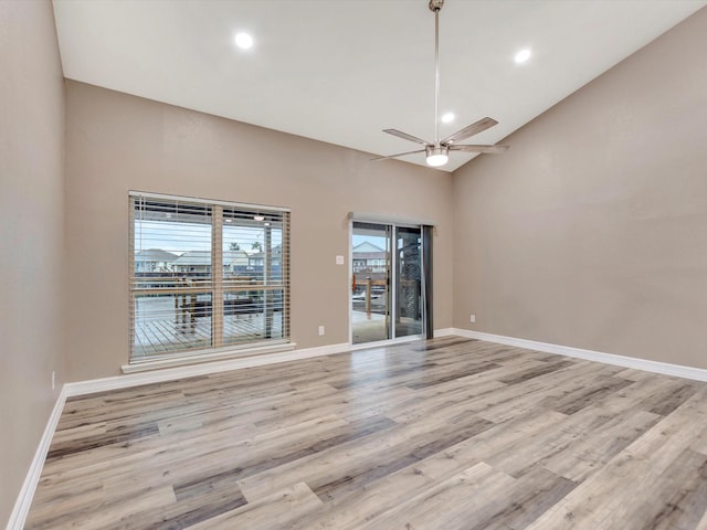 24 N Omega St, La Marque, TX 77568 - empty room with high vaulted ceiling, light hardwood / wood-style flooring, and ceiling fan