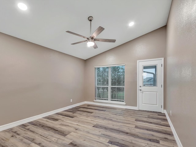 24 N Omega St, La Marque, TX 77568 - unfurnished room with light hardwood / wood-style flooring, vaulted ceiling, and ceiling fan
