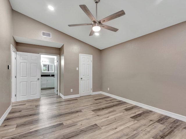 24 N Omega St, La Marque, TX 77568 - empty room with light hardwood / wood-style floors, ceiling fan, and lofted ceiling