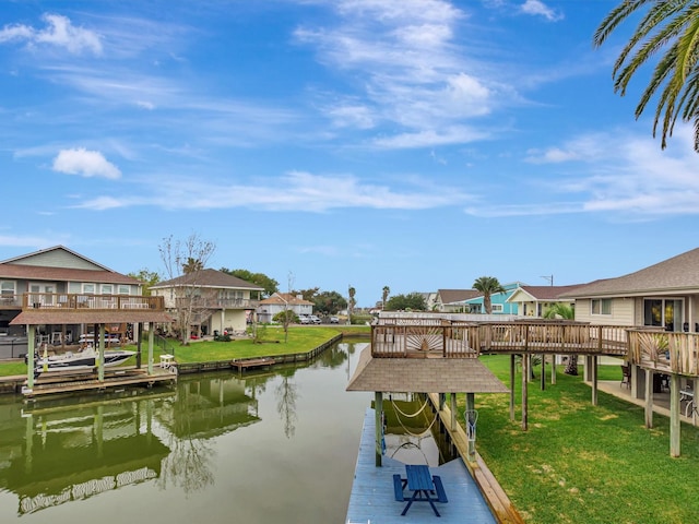 24 N Omega St, La Marque, TX 77568 - view of dock with a water view and a yard