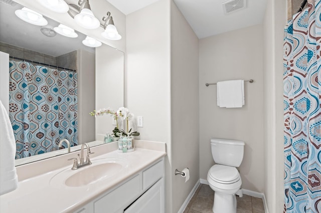 bathroom with tile patterned floors, walk in shower, vanity, and toilet