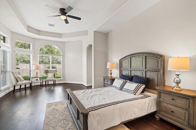 bedroom with ceiling fan and dark wood-type flooring