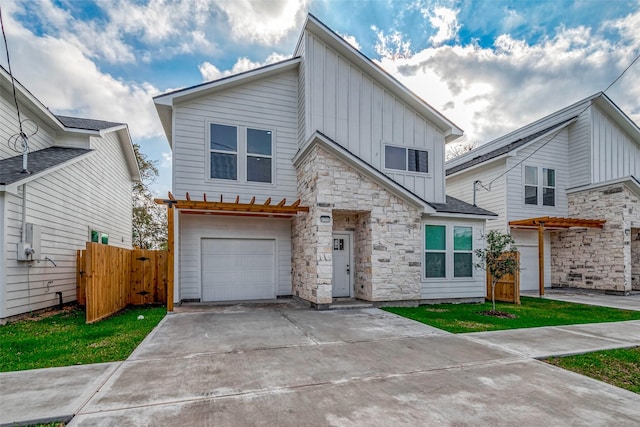 view of front of property with a front yard and a garage