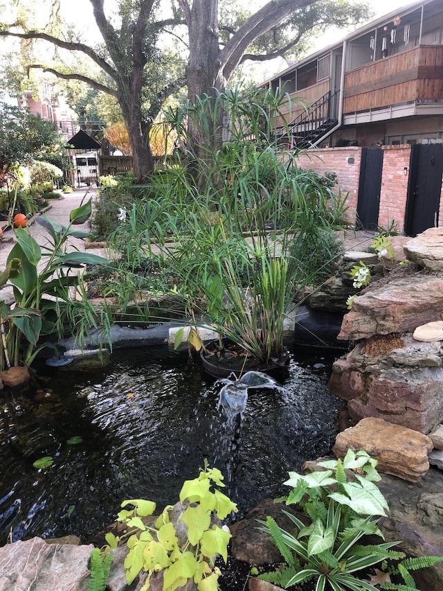 view of yard with a small pond