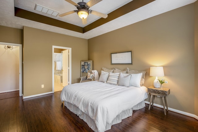 bedroom featuring ensuite bathroom, dark hardwood / wood-style floors, and ceiling fan