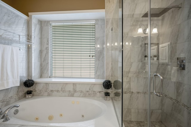 bathroom featuring separate shower and tub