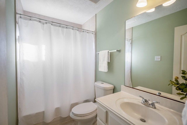 full bathroom with vanity, a textured ceiling, shower / bathtub combination with curtain, tile patterned flooring, and toilet