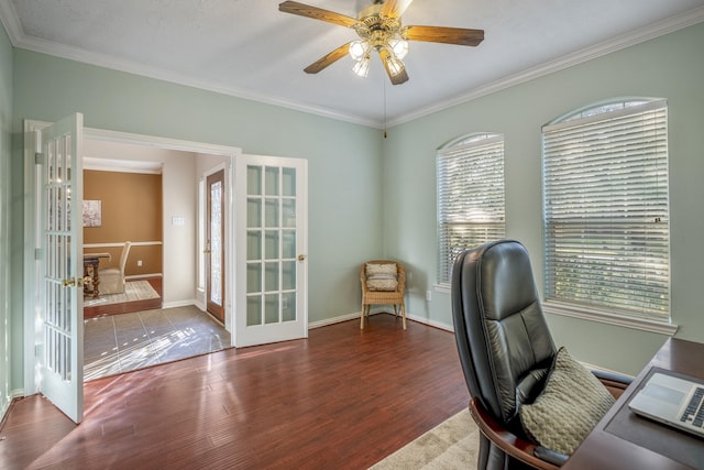 office space featuring dark hardwood / wood-style floors, crown molding, a wealth of natural light, and french doors