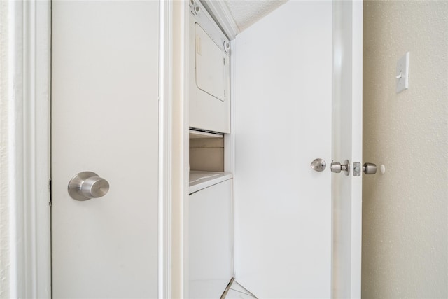 bathroom with stacked washer and dryer