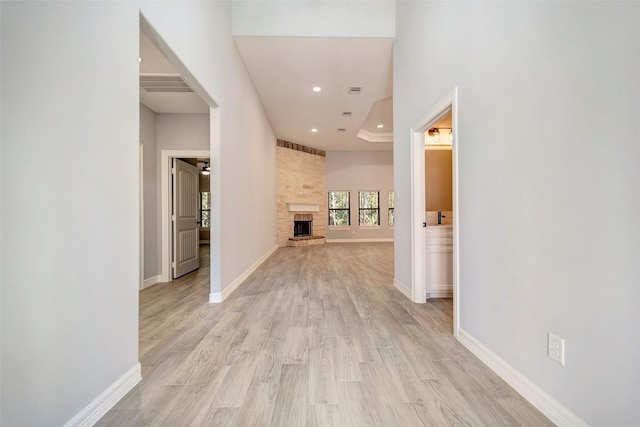 250 Broadmoor Dr, Huntsville, TX 77340 - hallway with baseboards, light wood-style floors, visible vents, and recessed lighting