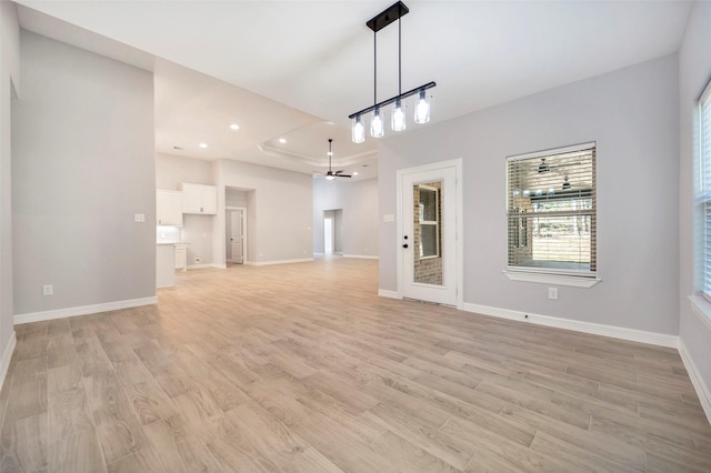 interior space with light wood-type flooring and ceiling fan