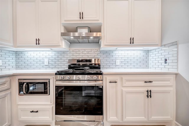 250 Broadmoor Dr, Huntsville, TX 77340 - kitchen featuring wall chimney exhaust hood, light countertops, white cabinets, and appliances with stainless steel finishes