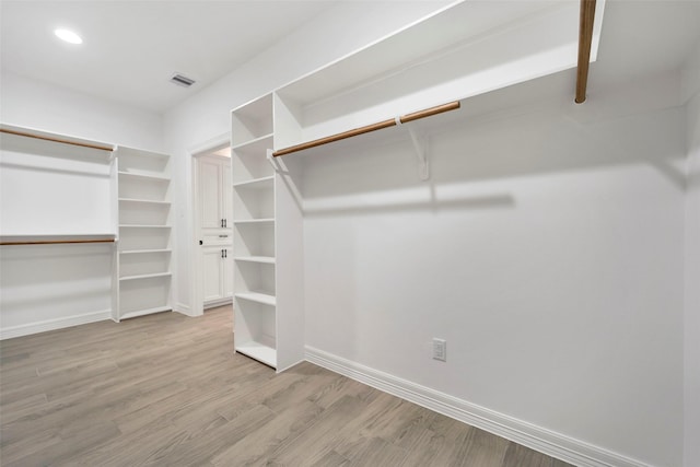 250 Broadmoor Dr, Huntsville, TX 77340 - walk in closet with wood finished floors and visible vents