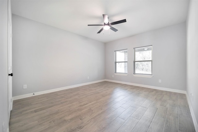 unfurnished room featuring ceiling fan and light hardwood / wood-style floors