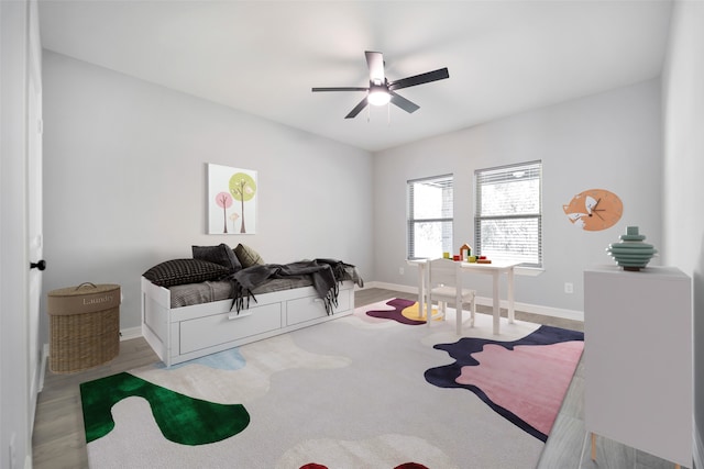 interior space with ceiling fan and light hardwood / wood-style floors