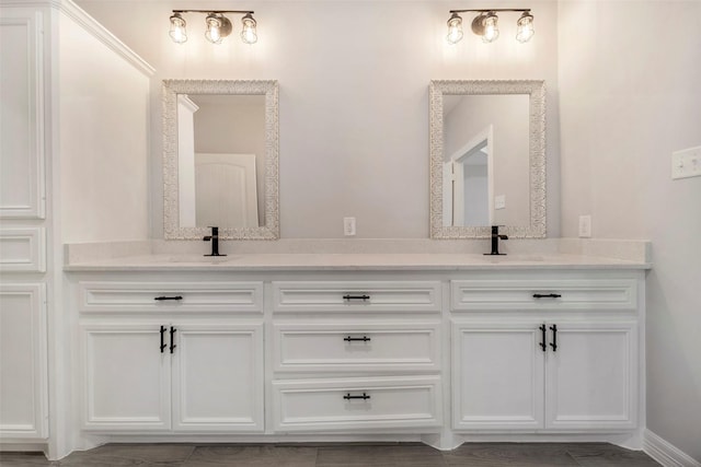 bathroom featuring vanity and hardwood / wood-style flooring