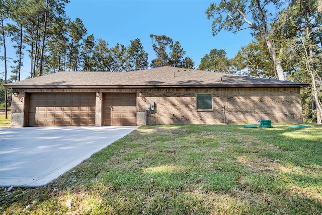 view of home's exterior featuring a yard and a garage