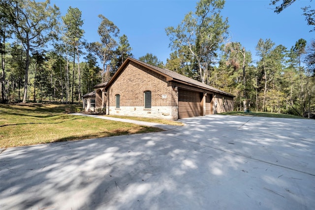 view of home's exterior featuring a yard and a garage