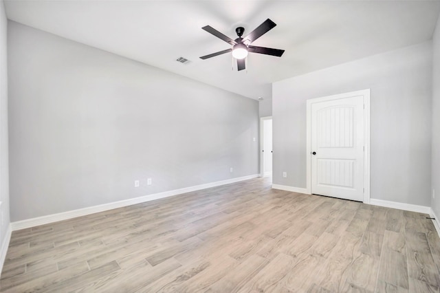 spare room featuring ceiling fan and light hardwood / wood-style flooring