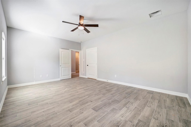 unfurnished room featuring light hardwood / wood-style floors and ceiling fan