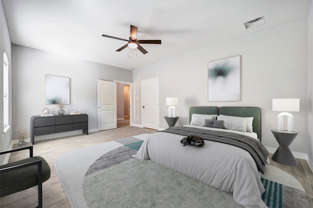 bedroom featuring ceiling fan and light hardwood / wood-style floors