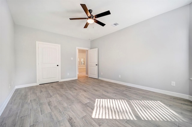 unfurnished bedroom featuring light wood-type flooring and ceiling fan