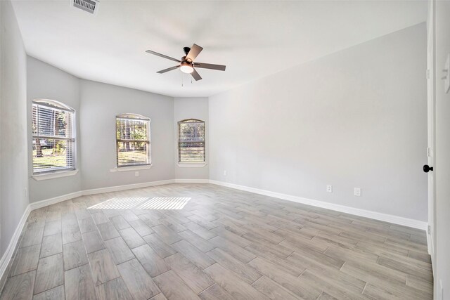 spare room with ceiling fan and light hardwood / wood-style floors