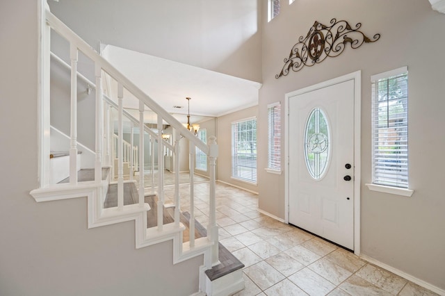 foyer entrance with an inviting chandelier