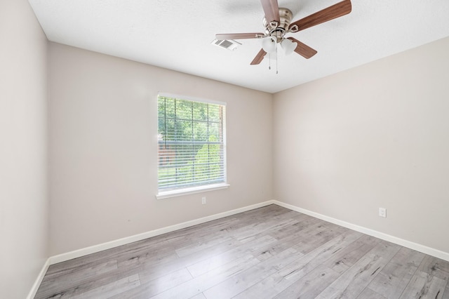 spare room featuring ceiling fan and light wood-type flooring