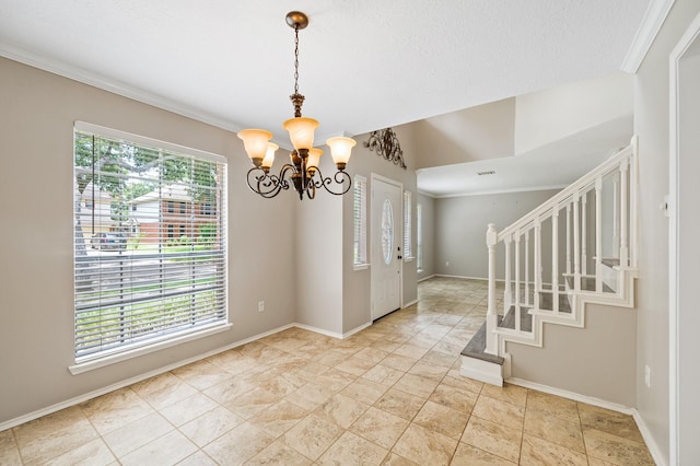 entryway with vaulted ceiling, an inviting chandelier, plenty of natural light, and ornamental molding