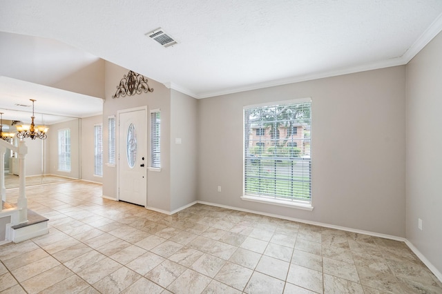 entryway featuring an inviting chandelier and ornamental molding