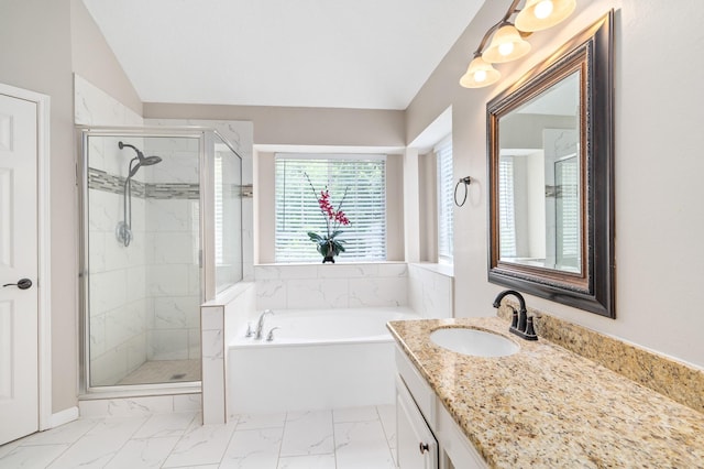 bathroom with vanity, vaulted ceiling, and independent shower and bath