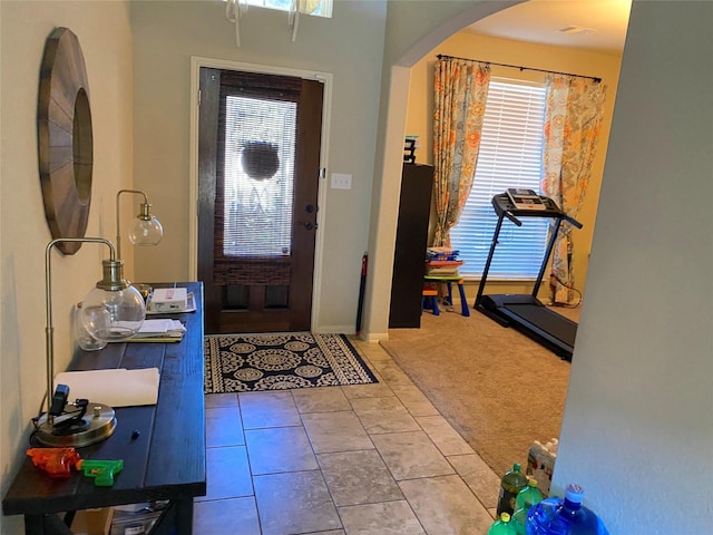 18539 Windy Knoll Way, Houston, TX 77084 - foyer with arched walkways and carpet floors